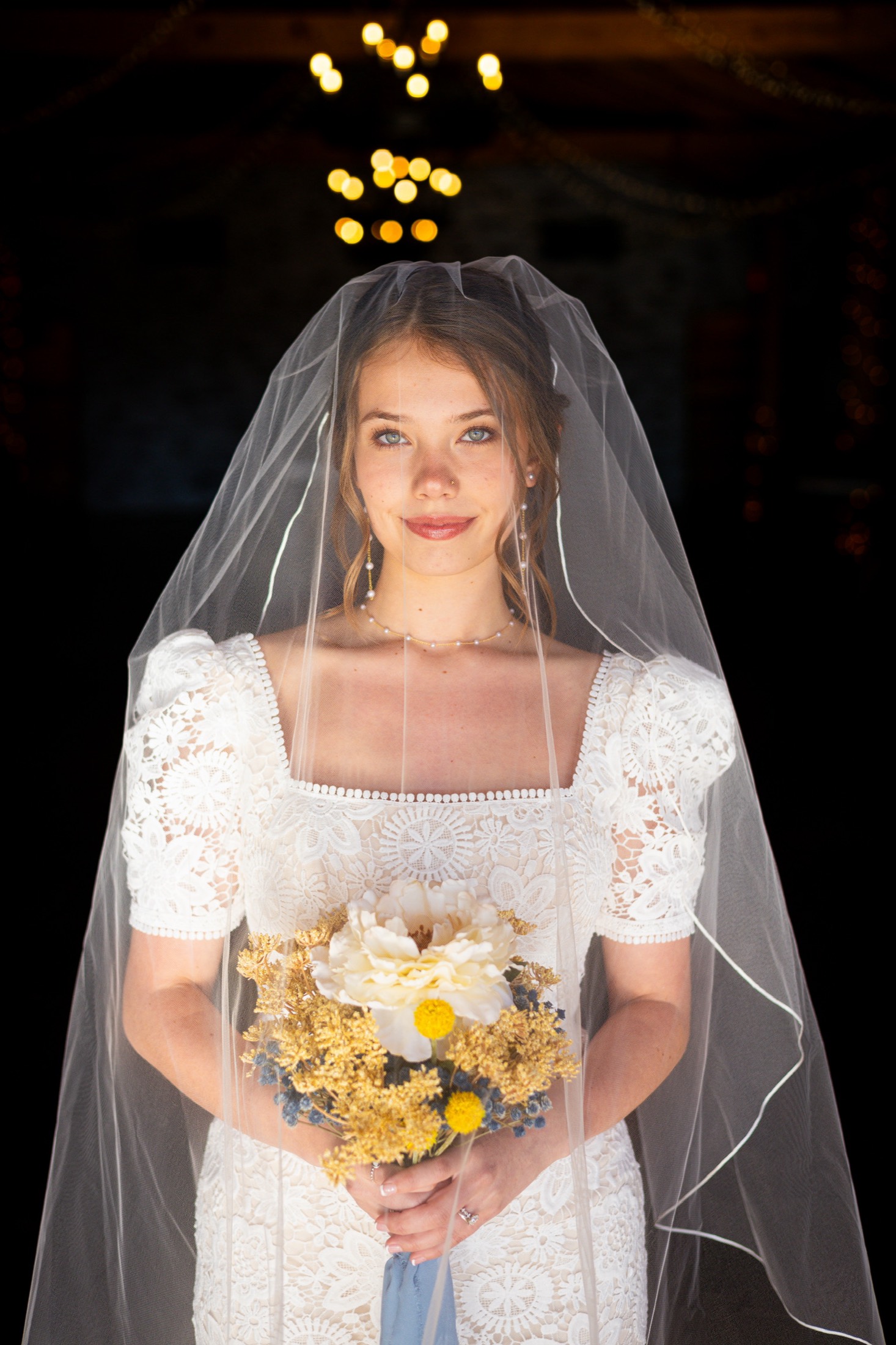 Bride in her veil holding a bouquet
